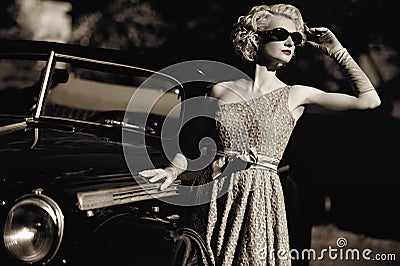 Woman and retro convertible Stock Photo