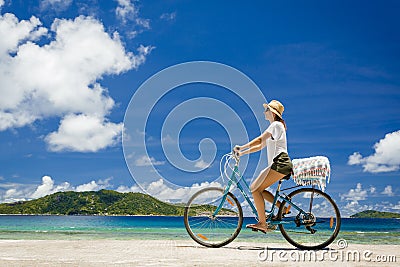 Woman ride along The Beach Stock Photo