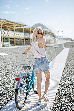 Woman ride bike on the summer road, Activities for keeping healthy, recreation Stock Photo