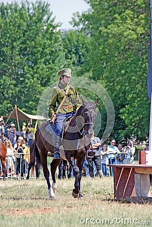 A woman rides a horse. Editorial Stock Photo