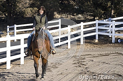 Woman Riding a Bay Horse Stock Photo