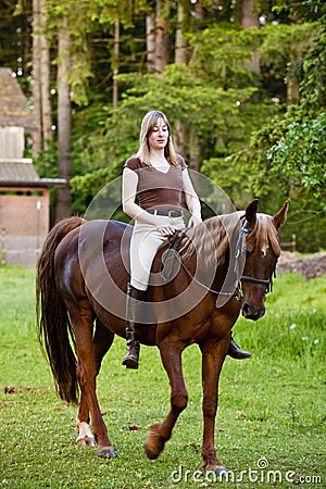 Woman riding her horse bareback Stock Photo