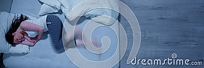 Woman With RLS - Restless Legs Syndrome Stock Photo