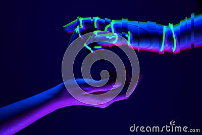 Woman and robot`s hands as a symbol of connections between people and technology. Neon colors. Stock Photo