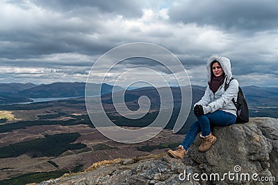 Woman on a rock Stock Photo