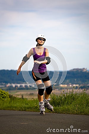 Woman on rollerblades Stock Photo