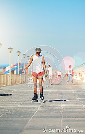 Woman. rollerskate and active for summer with hobby for fitness or health outdoors for exercise. Vacation, fun and Stock Photo