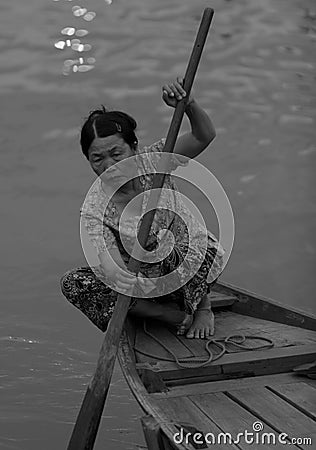 Woman rowing boat in Hoi An Editorial Stock Photo