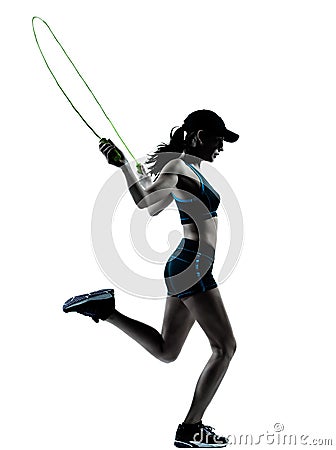 Woman runner jogger jumping rope Stock Photo