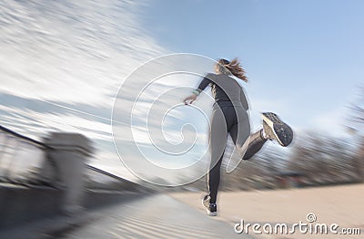 Woman running in the Retiro park in Madrid by a lake. Sport Stock Photo