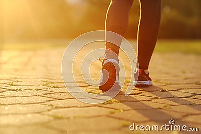 Woman and running shoes, exercising in the park. Stock Photo