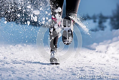 Woman running in winter Stock Photo