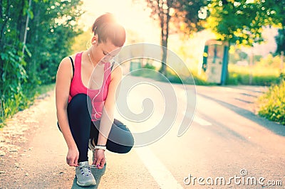 Woman running workout on spring sunny sunset Stock Photo