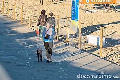 Woman runs along the Barcelona promenade in time of Covid 19 in winter 2021 Editorial Stock Photo