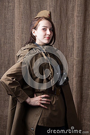 Woman in Russian military uniform with camera. Female war correspondent during the second world war. Stock Photo