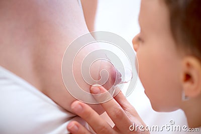 Woman`s breast with nipple shield Stock Photo