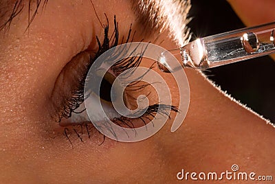 Woman`s eye and eyedropper2 Stock Photo