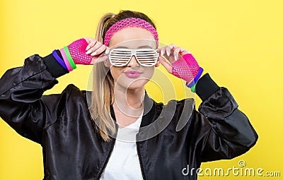 Woman in 1980`s fashion with shatter shade glasses Stock Photo