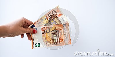 Woman`s hand with 50 euros money on a white background, copy space for text Stock Photo