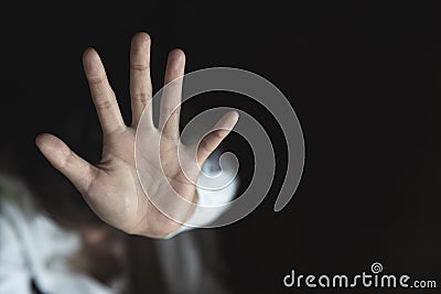 Woman`s hand extended signaling to stop useful to campaign against violence, gender or sexual discrimination Stock Photo