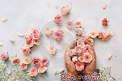 Woman`s hand holding beautiful bunch of mini roses Stock Photo