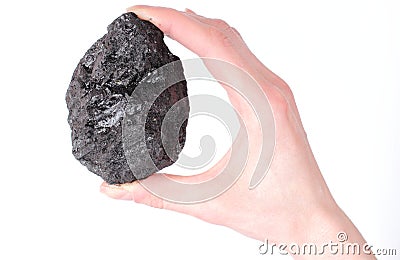 Woman's hand holding coal lump on white background Stock Photo