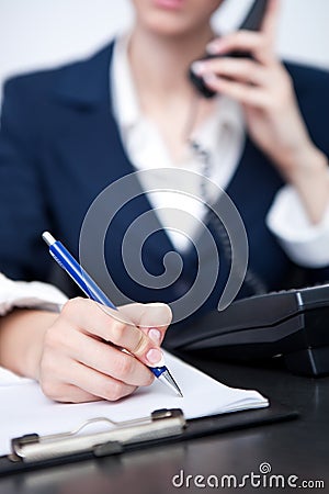 Woman's hand making note Stock Photo