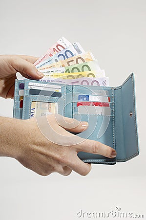 Woman's Hand Removing Euro Notes From Wallet Stock Photo