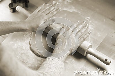 Woman's hands rolling dough for cookies Stock Photo