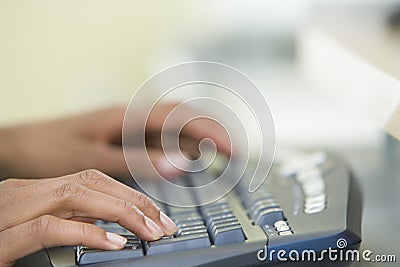 Woman's Hands Typing On A Computer Keyboard Stock Photo