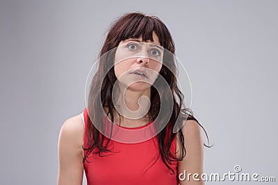 Woman's incredulity, overwhelmed by negativity Stock Photo