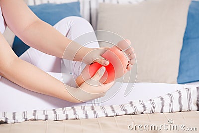 Woman`s leg hurts, pain in the foot, massage of female feet Stock Photo