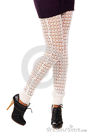 Woman's legs in a knitted leggings Stock Photo