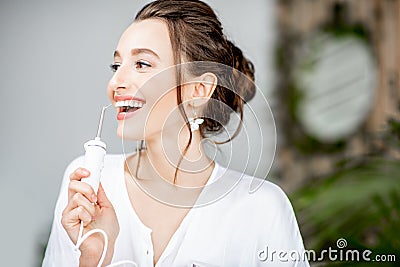 Woman`s portrait with irrigator Stock Photo