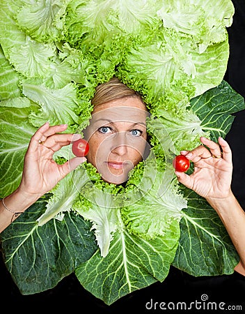 Woman with salal leafes around her head. Stock Photo