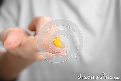 Woman with sample of cosmetic petrolatum on her finger, closeup. Space for text Stock Photo