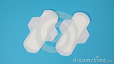 Woman sanitary napkins on blue background. Top view Stock Photo