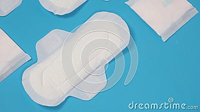 Woman sanitary napkins on blue background. Top view Stock Photo