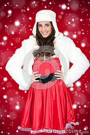 Woman in santa costume and white furry hat Stock Photo