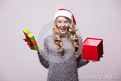 Woman in Santa hat open Christmas gift Stock Photo