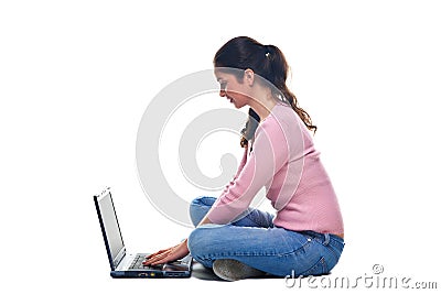 Woman sat using a laptop Stock Photo