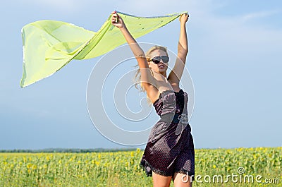 Woman with scarf fluttering in the breeze Stock Photo