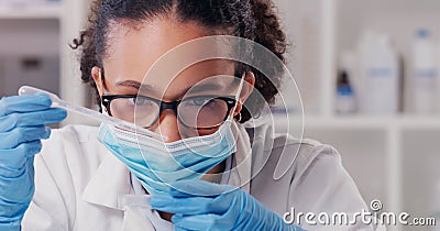 Woman scientist, petri dish test and face mask with focus on futuristic research and virus data. Science, African female Stock Photo