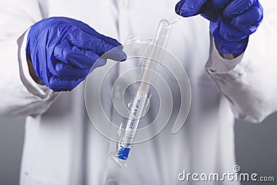 Woman scientists are using aqueous release micro-pipette Stock Photo