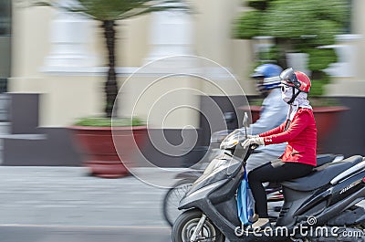 Woman on scooter Editorial Stock Photo