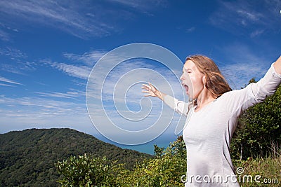 Woman screams in the mountains Stock Photo