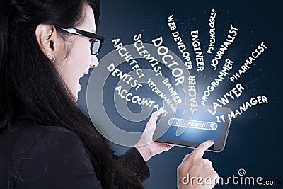 Woman searching jobs on digital tablet Stock Photo