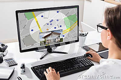 Woman Searching For Real Estate Online Stock Photo