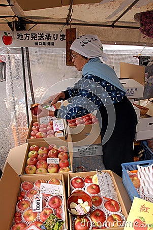 Woman selling apples Editorial Stock Photo