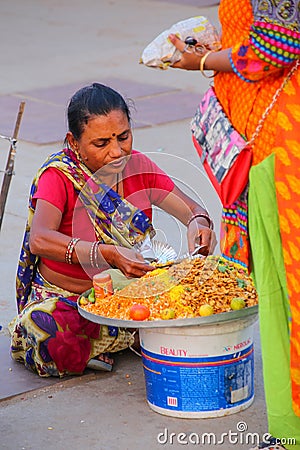 Woman selling food by Man Sagar Lake in Jaipur, India. Editorial Stock Photo